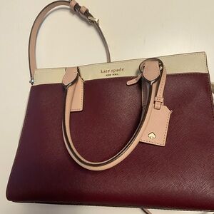 Kate Spade burgundy and pale pink shoulder bag with matching wallet.